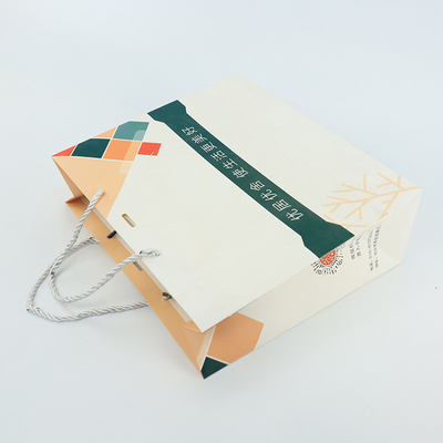 Les achats de boutique vêtent Logo Paper Bag Printed White fait sur commande avec la poignée de ruban